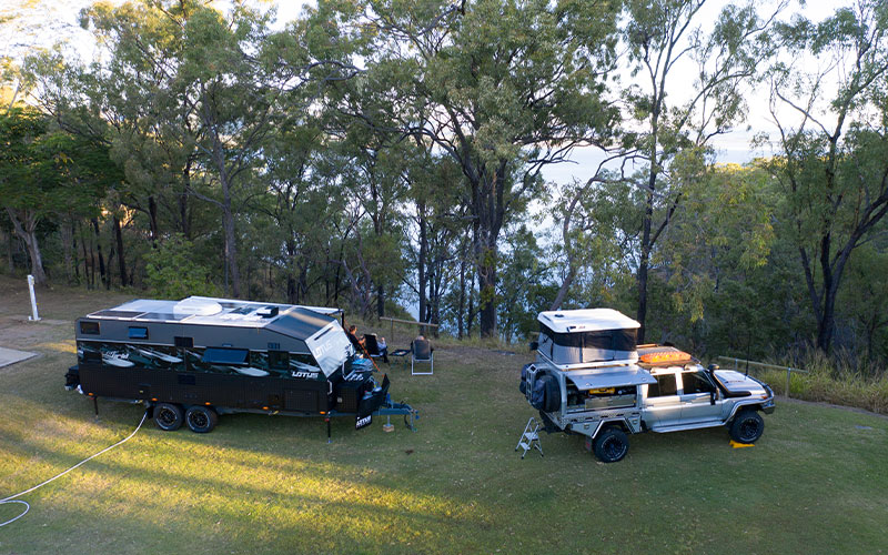 Caravan and 4WD parked in Park